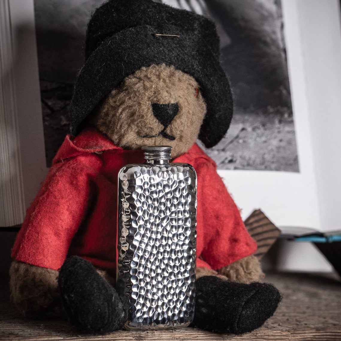 Close up of a hammered AR Wentworth flask next to a Paddington bear | Last Manner