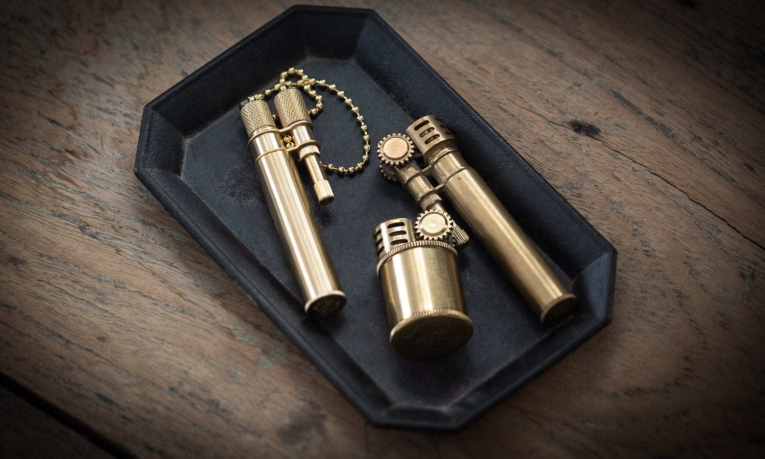 a collection of tokyo pipe co Neo lighters in brass