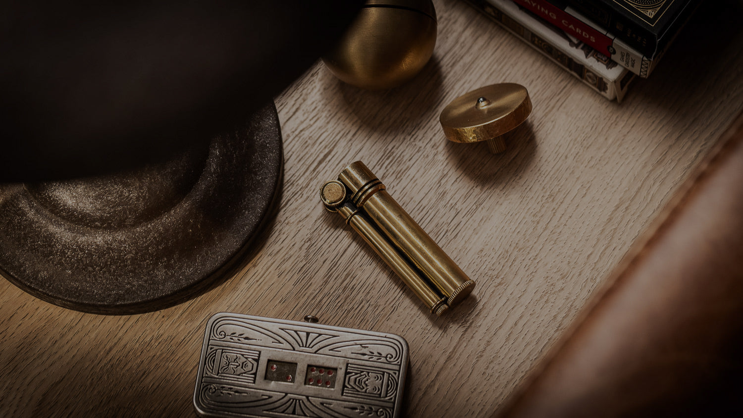 Tokyo Pipe Co Field L Brass on end table next to Felix Ure puzzle and spinning top