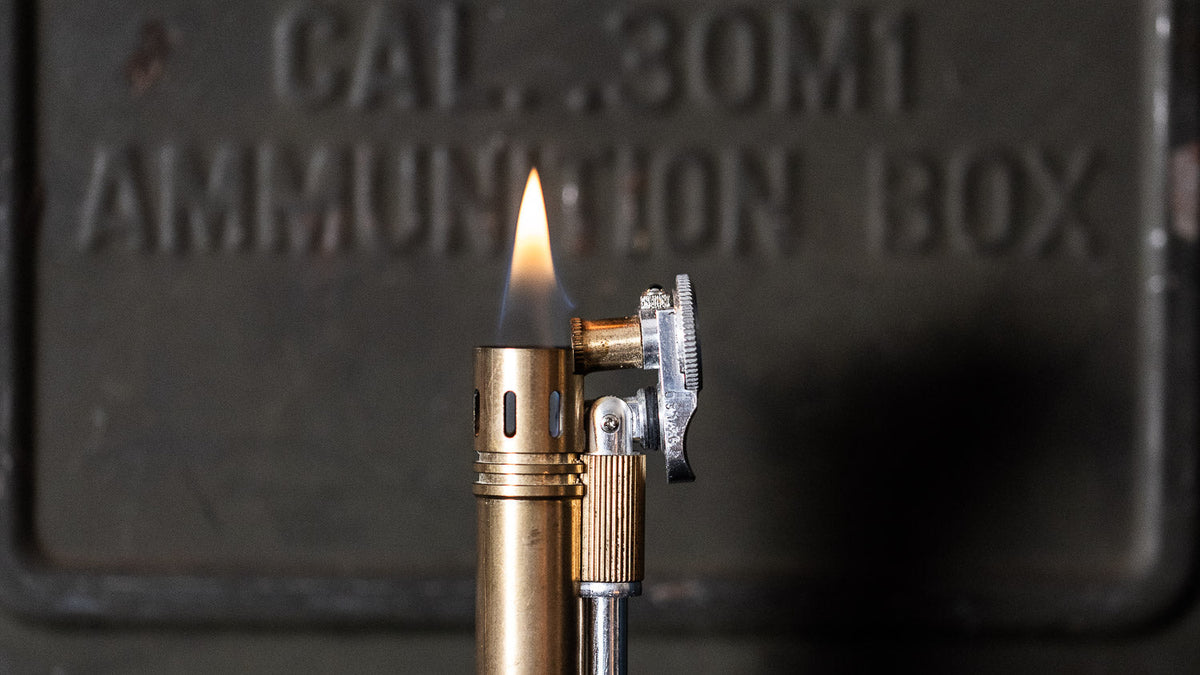 Tokyo Pipe Co Field S+ Combo in brass and duralumin lying next to a brass ruler