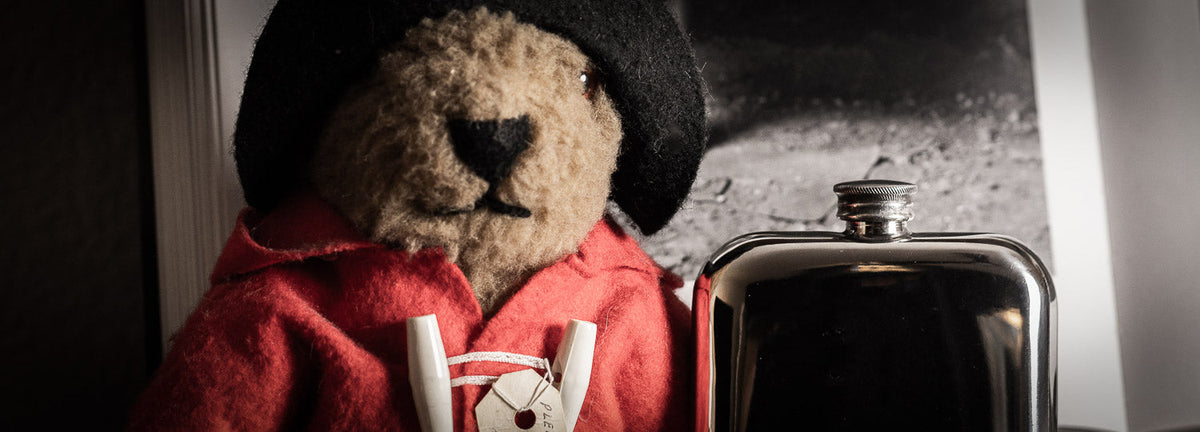 A.R Wentworth pewter flask next to teddy bear