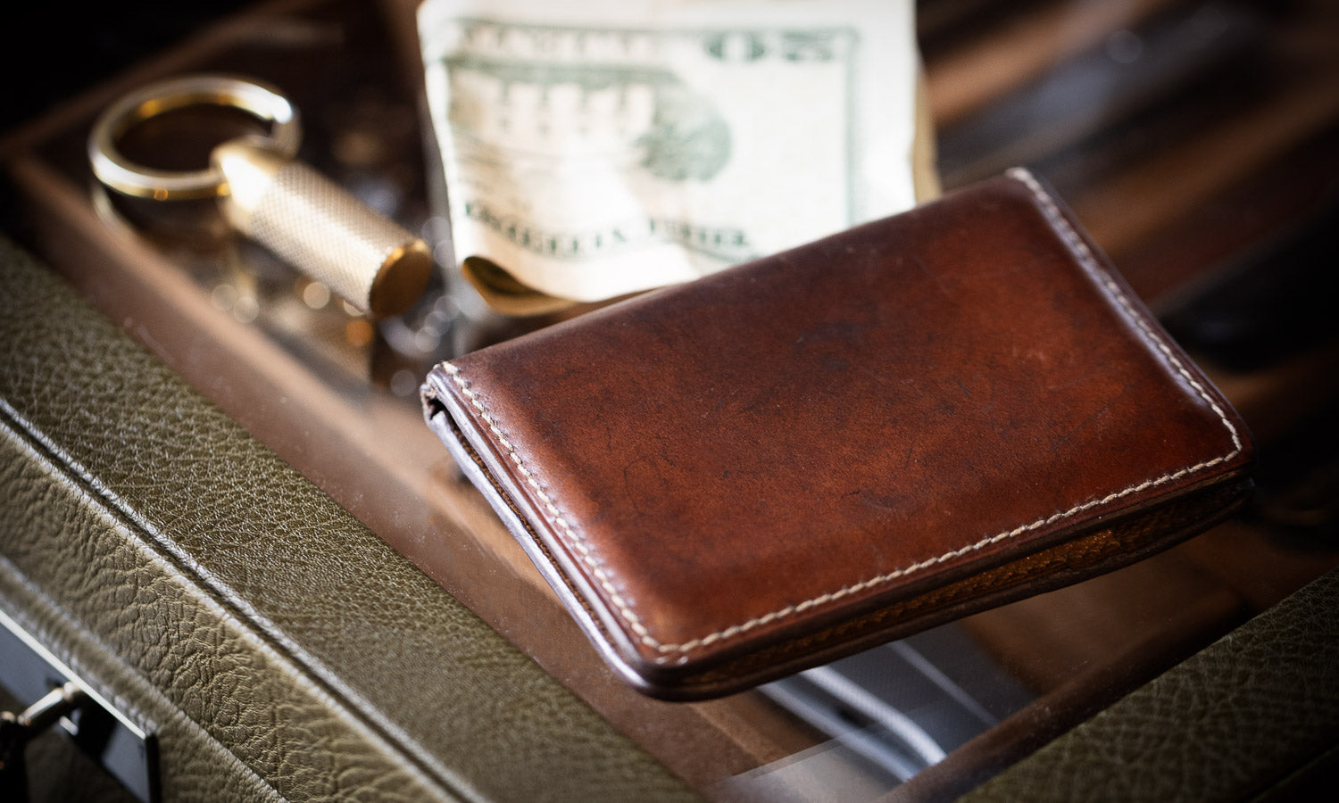 brown cordovan with key cache and money